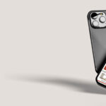 A photo of two mobile phones, one with a mockup of the Simonds Explore website.