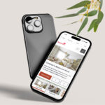 A photo of two mobile phones, one with a mockup of the Simonds Explore website.