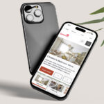 A photo of two mobile phones, one with a mockup of the Simonds Explore website.